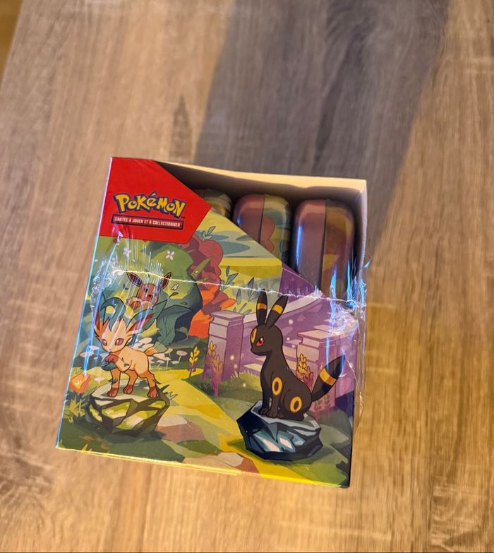 Display Pokémon scellé min tins ev8.5 - évolution prismatique