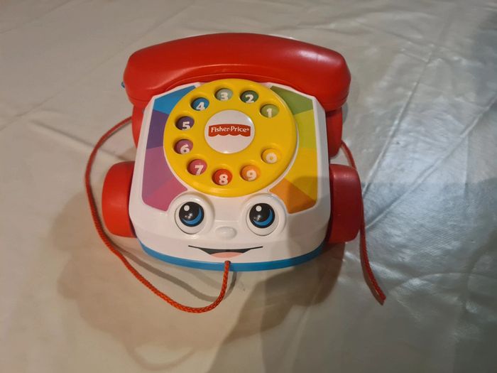 Téléphone animé à tirer Fisher Price vintage
