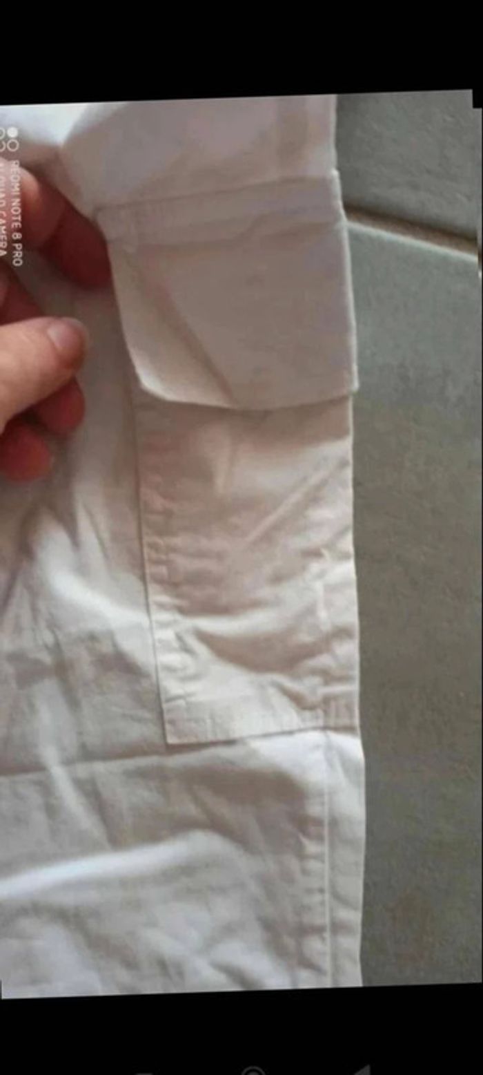 Pantalon blanc cordon léger taille 38
Longueur 84 cm - photo numéro 3