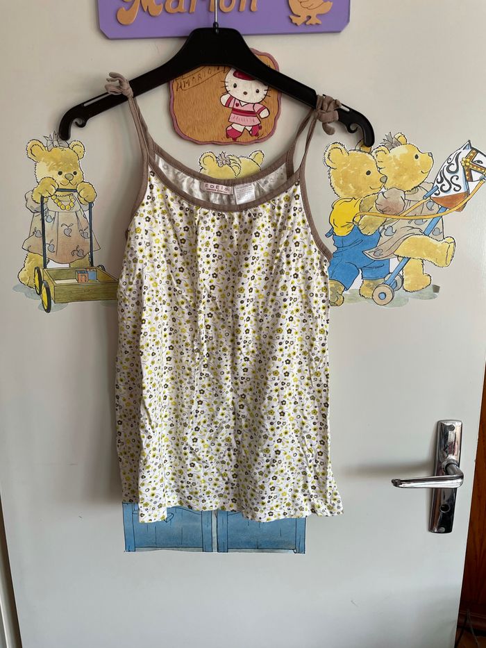 Débardeur blanc à fleurs, taille 12 ans, marque La Redoute.