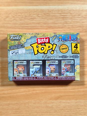 Boîte 4 Funko Bitty Pop! - One Piece - Nami, Arlong, Nojiko & Buggy (CHASE)