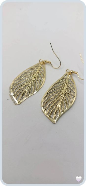 magnifique boucles d oreilles en acier dorée