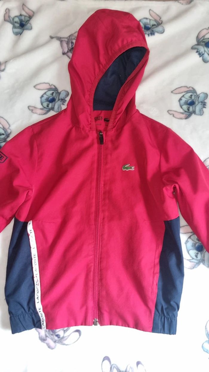 Veste lacoste 6 ans en bon état