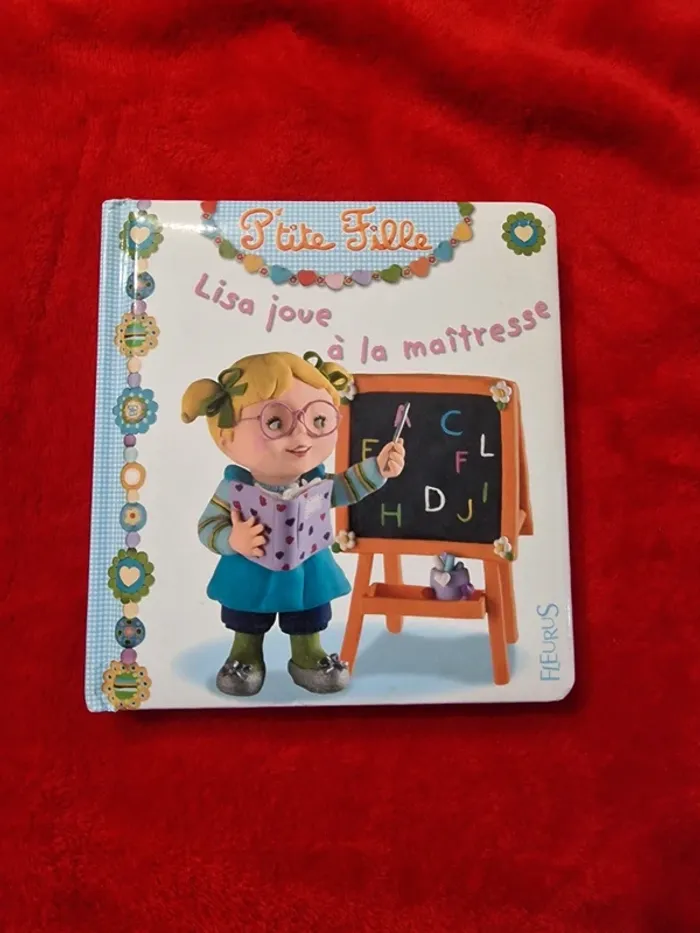 Livre 1 p'tite fille Lisa joue à la maîtresse