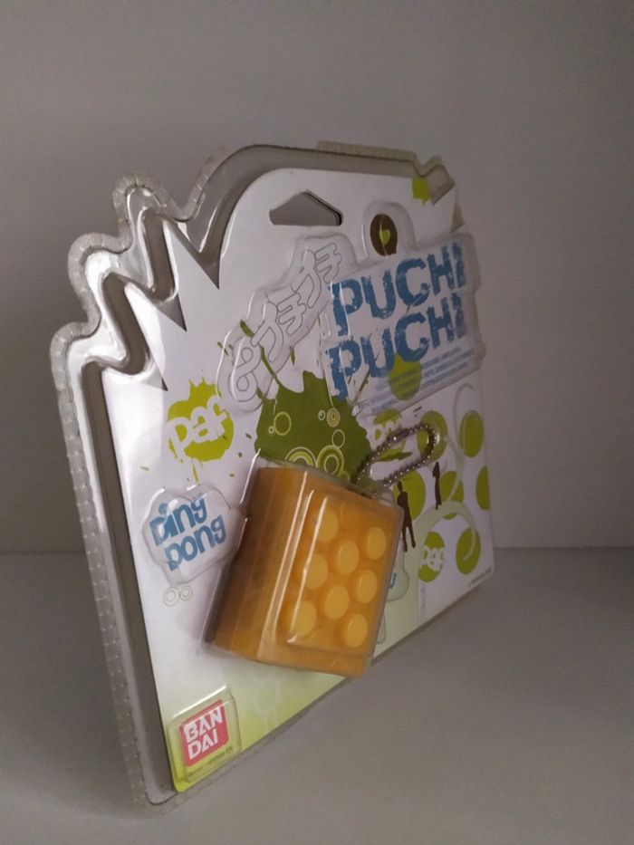Porte-clés électronique Puchi Puchi jaune Bandai 2008 neuf - photo numéro 2
