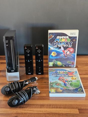 Nintendo Wii noir # Pack Super Mario Galaxy 1 et 2 pour 2 personnes #