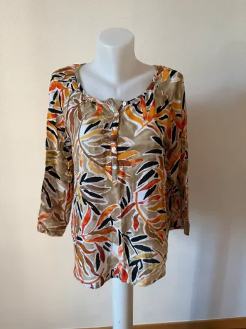 Blouse coloré en très bon état taille 38-40