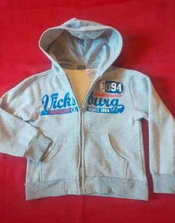 Veste à capuche  zippé taille 8 ans