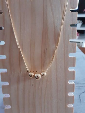 Collier doré doublé avec 3 boules
