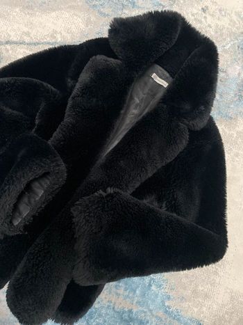Manteaux en fausse fourrure noir