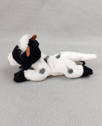 Peluche doudou vache NICOTOY SIMBA 22 cm noir blanc marron billes corps