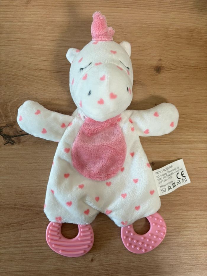 Doudou plat licorne rose blanc anneau dentition zd trading action