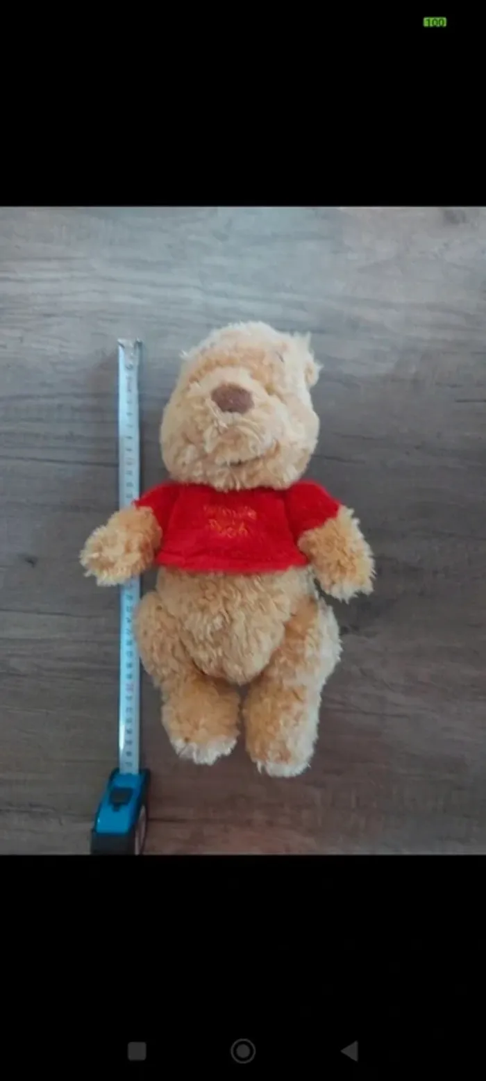 Peluche winnie l'ourson 
Bras et jambes articulés