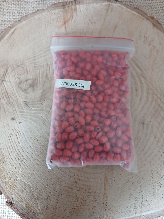 Sachet de 30 gramme de perles en bois rouge