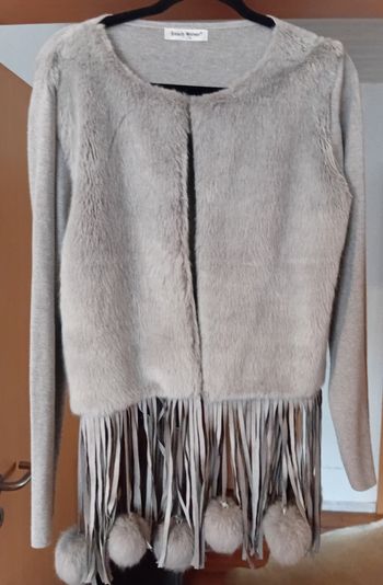 Gilet original à pompons
