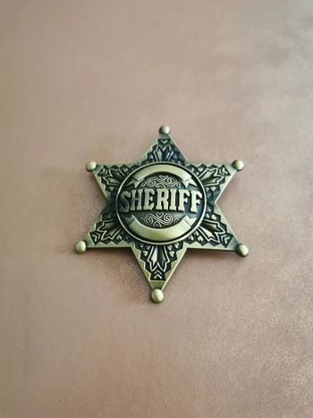 Étoile de sheriff cowboy country doré