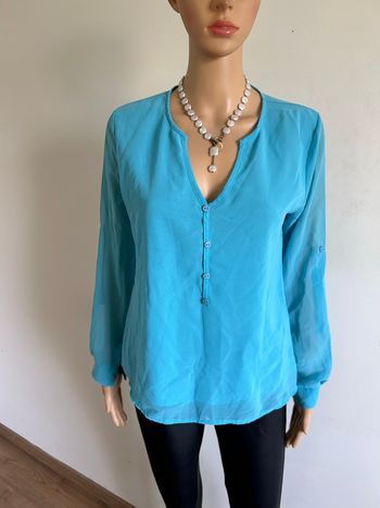 Blouse turquoise à manches longues taille 2 état satisfaisant (avec défaut)
