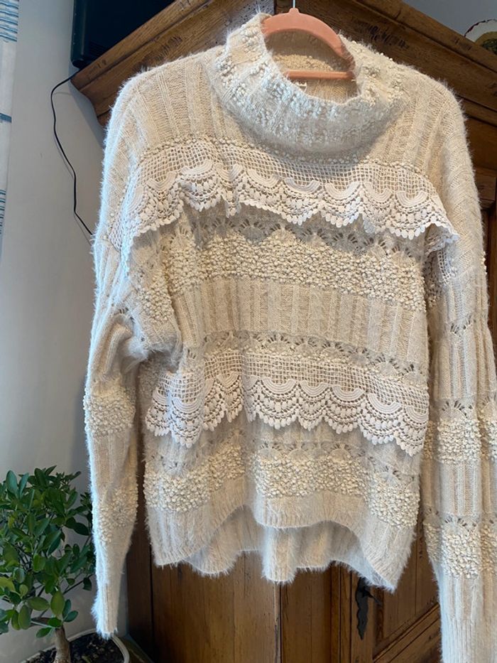 Pull col montant