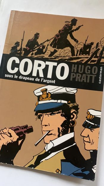 corto sous le drapeau de l’argent
