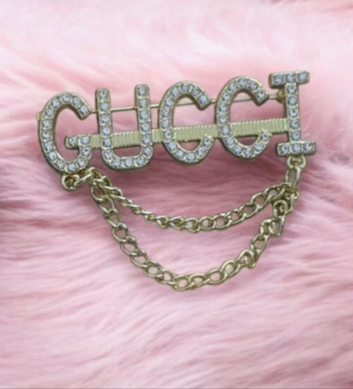 Broche or doré Gucci