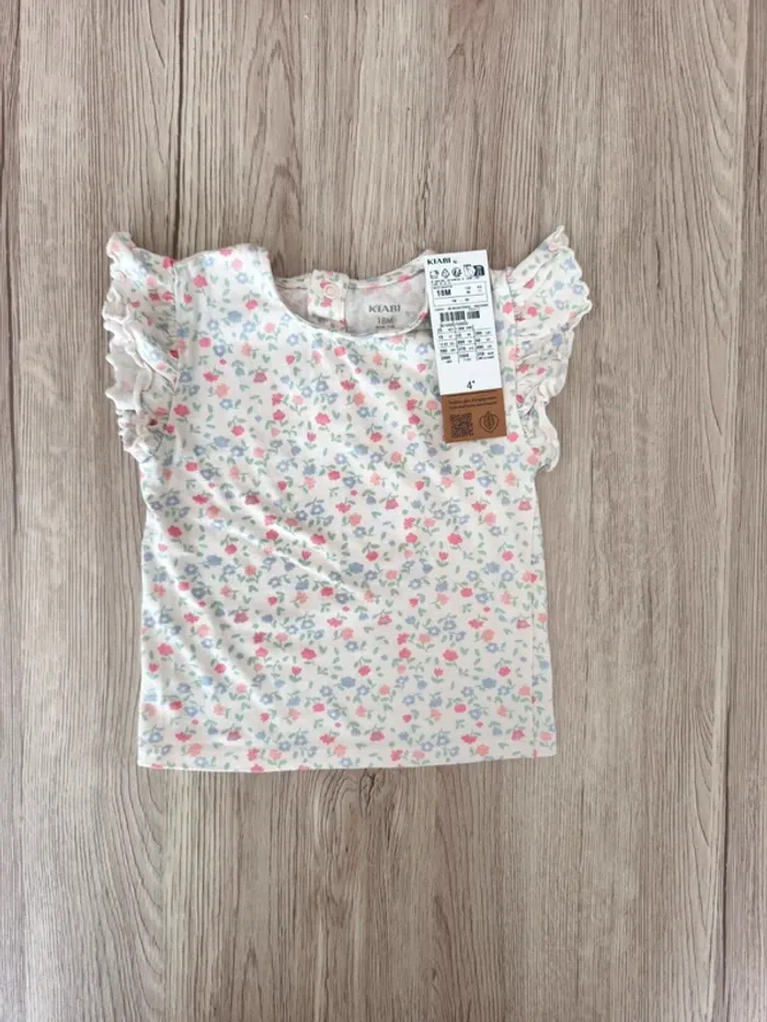 T-shirt sans manche froufrou épaule