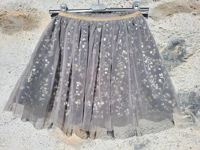 Gémo, jupe de fêtes, tulle,motifs feuilles dorées sur noire, 10 ans - photo numéro 2