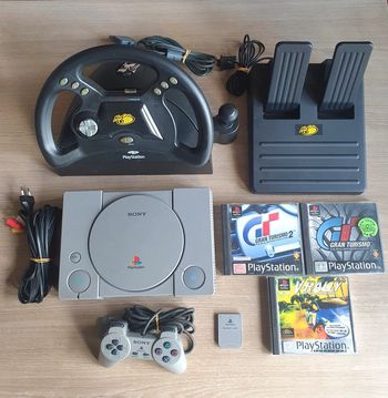 Lot Console PlayStation 1 PS1 + 1 Manette Officielle + 1 Volant + 1 Carte Mémoire & 3 Jeux