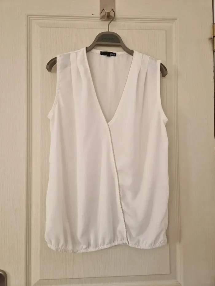 Haut blanc avec liseret or femme etam taille M/38