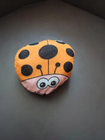 Peluche Coccinelle orange point noir toute douce