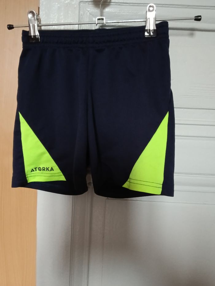 Short decathlon marine et jaune fluo