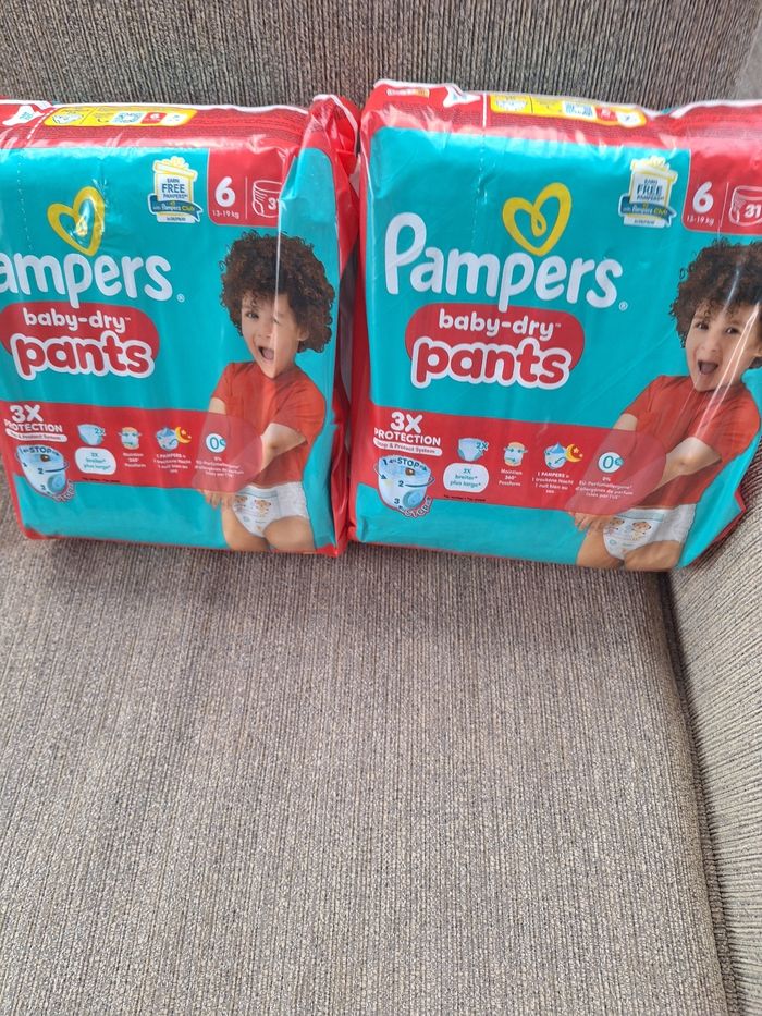 2 paquets de 32 pants pampers taille 6 pour bébé de 13 à 19 kg  soit 62 pants
