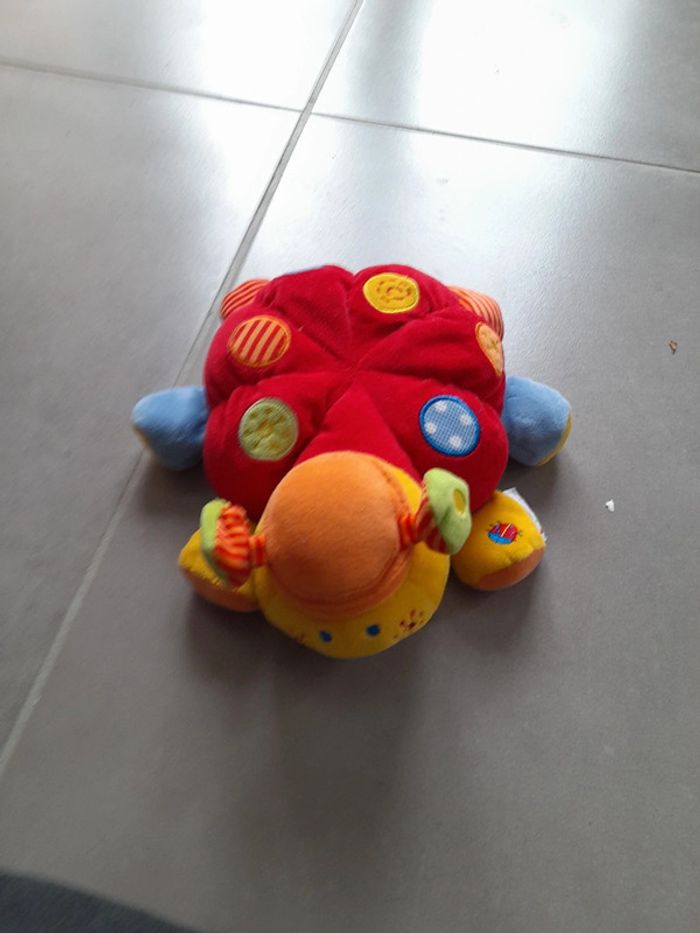 Peluche coccinelle motricité