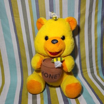 Peluche ourson jaune et orange