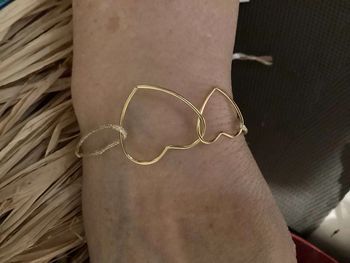 Bracelet 2 cœurs fins acier inoxydable or entrelacés cordon doré pailleté