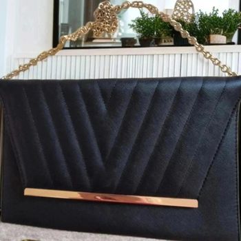 Sac pochette noir barre doré