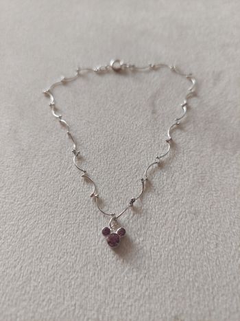 Bracelet coloris argenté pendentif tête Mickey rose TBE