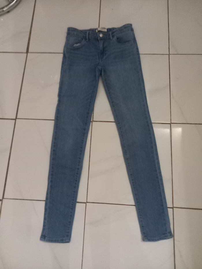 Levi,s fille taille 14 ans couleur bleu clair tres bonne etat - photo numéro 9