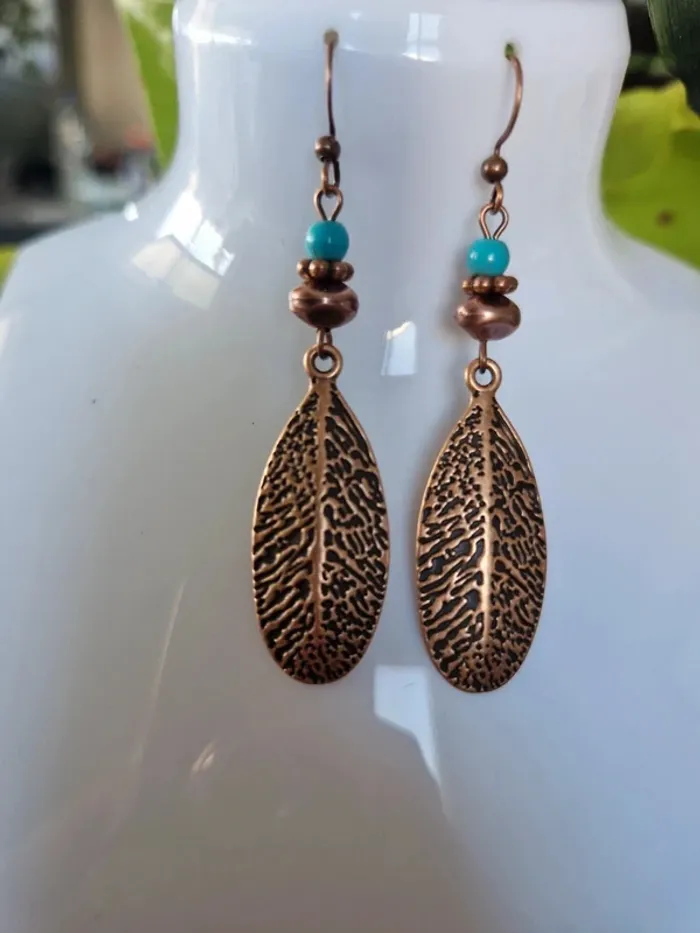 Boucles d'oreilles fantaisies couleur bronze plume