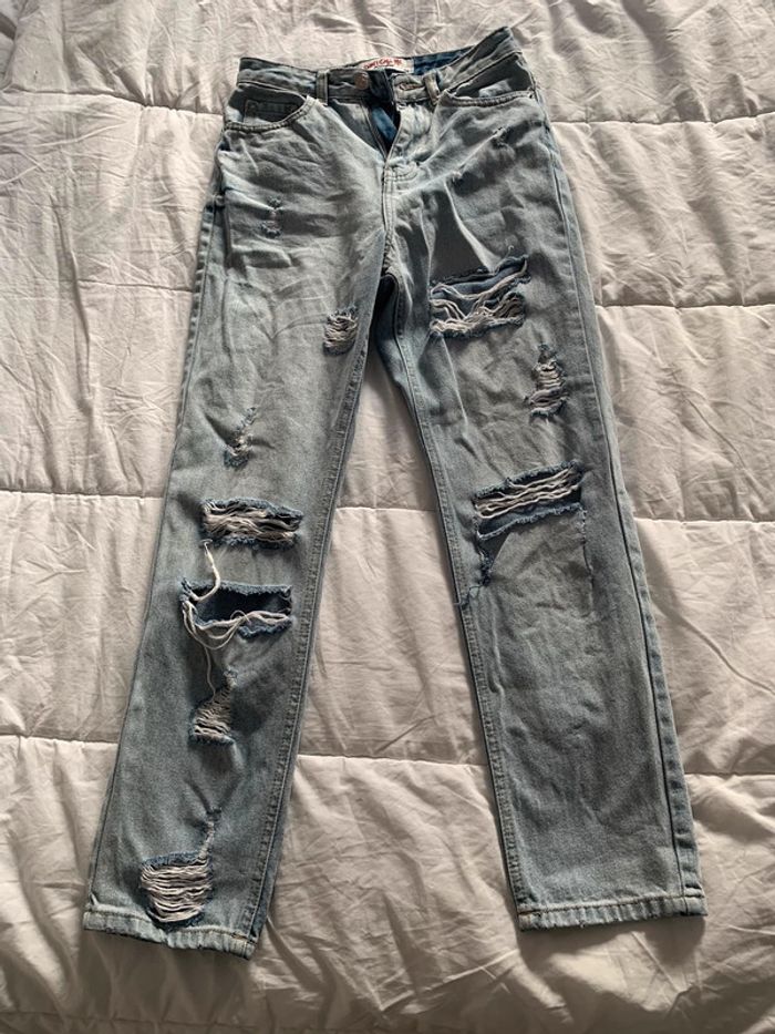 Jeans a troue taille 34