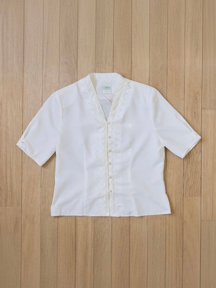 Chemisier blanc broderie style chinois
tendance - photo numéro 1