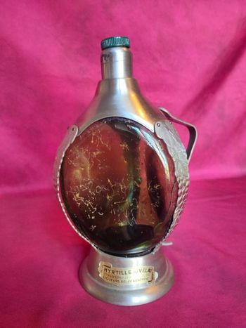 Ancienne bouteille musicale en verre et métal