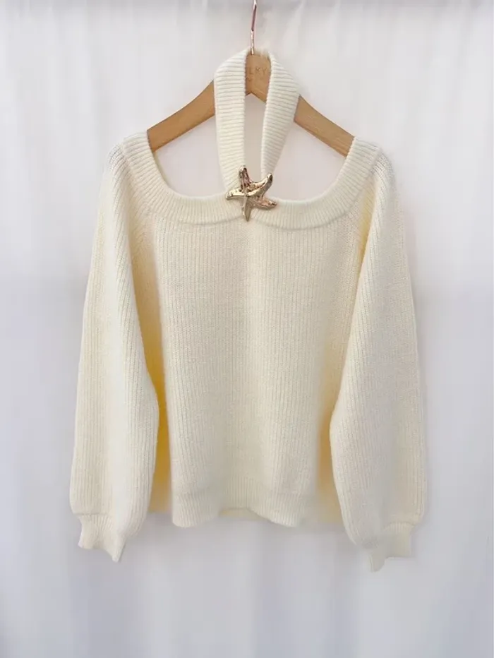 Pull beige étoilé col dénudé tendance laine