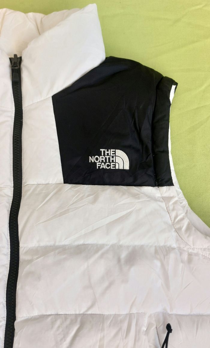 The North Face white and black puffer vest