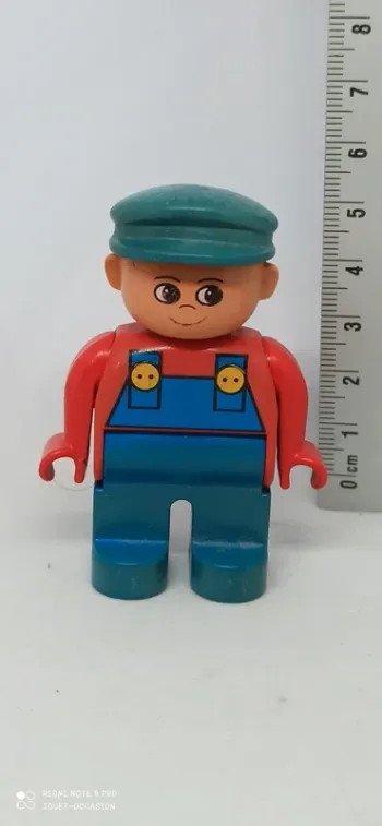 Homme avec cotte de travail bleue lego duplo