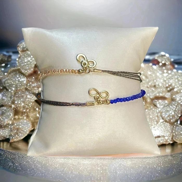 Splendide lot de deux bracelets infinis