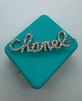 Barrette à cheveux dorée strass brillant