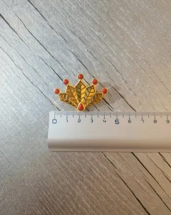 Broche doré du paon