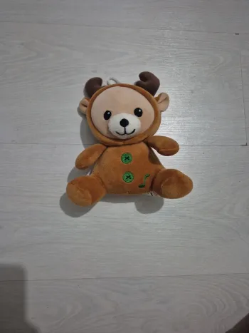Peluche ours musical de Noël