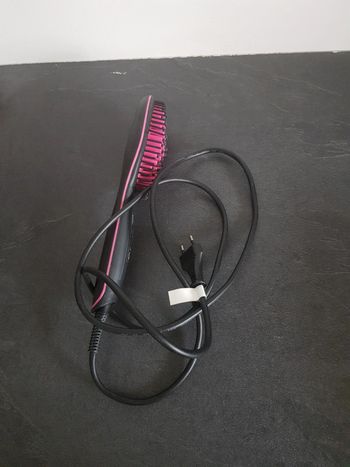 Brosse chauffante et lissante