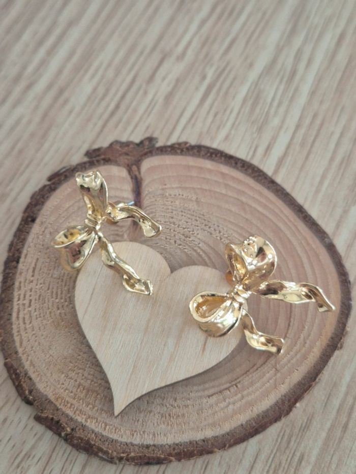 Jolie boucle d'oreilles nœud en acier